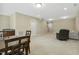 Large basement living area with staircase, wet bar and dinette set is an entertainer's dream at 109 Lyngrove St, Holly Springs, NC 27540