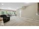 This beige basement features neutral carpet, a seating area, a dinette set, and recessed lighting at 109 Lyngrove St, Holly Springs, NC 27540