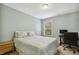 Bedroom featuring carpet flooring, a home office area, and natural light from the window at 109 Lyngrove St, Holly Springs, NC 27540