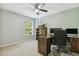 Bedroom featuring a ceiling fan, sailboat decor, carpet flooring, and a home office desk at 109 Lyngrove St, Holly Springs, NC 27540