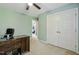 Bedroom with green walls, white closet doors, carpet flooring, and access to the home gym at 109 Lyngrove St, Holly Springs, NC 27540