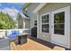 Outdoor deck featuring cozy furniture and access to home at 109 Lyngrove St, Holly Springs, NC 27540