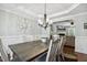 Elegant dining room with stylish chandelier and dining set at 109 Lyngrove St, Holly Springs, NC 27540