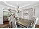 Elegant dining room with stylish chandelier and dining set at 109 Lyngrove St, Holly Springs, NC 27540