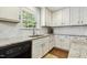 This kitchen features white cabinets, stainless steel appliances, and granite countertops, perfect for cooking and entertaining at 109 Lyngrove St, Holly Springs, NC 27540