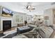Inviting living room featuring a fireplace, hardwood floors, and ample seating at 109 Lyngrove St, Holly Springs, NC 27540