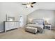 Bright, spacious primary bedroom with vaulted ceiling, fan, and ample natural light at 109 Lyngrove St, Holly Springs, NC 27540