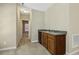 Basement wet bar with mini fridge, sink and wood cabinets will be a great place to entertain your Gathering at 109 Lyngrove St, Holly Springs, NC 27540