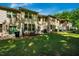 This backyard features green grass, a fenced patio area, and well-maintained exteriors with lots of natural light at 1101 Compass Dr, Durham, NC 27713