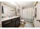 Full bathroom features a vanity with sink, a toilet, and a shower with curtain at 1101 Compass Dr, Durham, NC 27713
