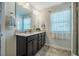Updated bathroom features double sinks and a granite countertop at 1101 Compass Dr, Durham, NC 27713