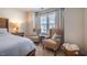 Bedroom sitting area features two chairs and a side table at 1101 Compass Dr, Durham, NC 27713