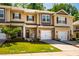 Charming townhome features stone accents, a one-car garage, and inviting curb appeal at 1101 Compass Dr, Durham, NC 27713