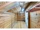 Finished basement storage featuring rustic wood paneling, built-in shelving, and ample space at 1111 College St, Oxford, NC 27565