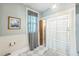 Bright bathroom featuring a tiled floor, shower and natural light from the window at 1111 College St, Oxford, NC 27565