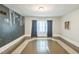 Bright bedroom with unique decorative wall and modern ceiling light at 1111 College St, Oxford, NC 27565