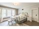 Comfortable bedroom featuring a vintage vanity, area rug, and plenty of natural light at 1111 College St, Oxford, NC 27565