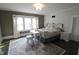 Comfortable bedroom featuring a vintage vanity, area rug, and plenty of natural light at 1111 College St, Oxford, NC 27565