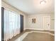 Bright bedroom with light walls, and dark-trimmed windows at 1111 College St, Oxford, NC 27565