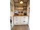 A charming coffee bar with a butcher block countertop and white cabinets at 1111 College St, Oxford, NC 27565