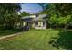 Traditional home with a covered front porch, dormer windows, and a well-manicured lawn at 1111 College St, Oxford, NC 27565
