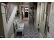 Entryway with decorative tile flooring, bench seating and access to the front door at 1111 College St, Oxford, NC 27565