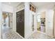 Charming hallway with patterned tile floor leading to the staircase and the kitchen at 1111 College St, Oxford, NC 27565