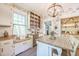 Bright kitchen with white cabinets, wood countertops and modern appliances at 1111 College St, Oxford, NC 27565