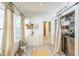 Well-organized laundry room with modern appliances, patterned tile floor and lots of natural light at 1111 College St, Oxford, NC 27565