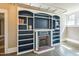Cozy living room with built-in bookshelves and decorative fireplace at 1111 College St, Oxford, NC 27565