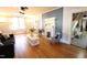 Spacious living room with hardwood floors, fireplace, and access to the entry at 1111 College St, Oxford, NC 27565