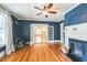 Charming living room with hardwood floors, fireplace and white trim at 1111 College St, Oxford, NC 27565