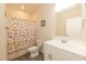 Clean bathroom with a vanity, a toilet, and a shower with fun, colorful curtains and decor at 116 Laurel Ave, Durham, NC 27701