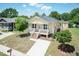 Charming home featuring a front porch, new siding, and manicured lawn at 116 Laurel Ave, Durham, NC 27701