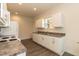 Well-lit kitchen featuring modern appliances, ample counter space, and clean lines for a contemporary feel at 116 Laurel Ave, Durham, NC 27701