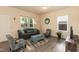 Comfortable living room featuring plush seating, neutral decor, and a cozy atmosphere for relaxation at 116 Laurel Ave, Durham, NC 27701