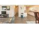 Open-concept living room with hardwood floors and a view of the adjacent kitchen and dining area at 116 Laurel Ave, Durham, NC 27701