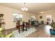 Bright living space with modern flooring, stylish furnishings, and ample natural light from large windows at 116 Laurel Ave, Durham, NC 27701