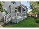 Backyard with a screened porch, stairs, lattice work and a grill and landscaping at 121 Bridgegate Dr, Cary, NC 27519