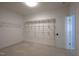 Walk-in closet featuring installed shelves, carpeting and a doorway to a bedroom at 121 Bridgegate Dr, Cary, NC 27519