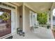 Inviting front porch with white rocking chairs and decorative plants, perfect for relaxing outdoors at 121 Bridgegate Dr, Cary, NC 27519