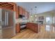 Gourmet kitchen featuring custom cabinets, stainless steel appliances, granite countertops, and a center island at 121 Bridgegate Dr, Cary, NC 27519