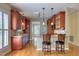 Gourmet kitchen featuring custom cabinets, stainless steel appliances, granite countertops, and a center island at 121 Bridgegate Dr, Cary, NC 27519