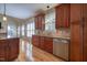 Well-equipped kitchen featuring stainless steel appliances, granite countertops, and custom cabinetry at 121 Bridgegate Dr, Cary, NC 27519