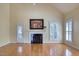 Bright living room features vaulted ceiling, fireplace, and hardwood floors at 121 Bridgegate Dr, Cary, NC 27519