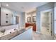 Spacious main bathroom features walk-in shower, dual vanities, and elegant fixtures at 121 Bridgegate Dr, Cary, NC 27519