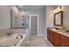 Beautiful main bathroom with soaking tub, frameless shower, and dual vanities at 121 Bridgegate Dr, Cary, NC 27519