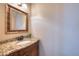 Elegant powder room features granite countertop, bronze faucet, and decorative mirror at 121 Bridgegate Dr, Cary, NC 27519