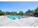 Community swimming pool with clear blue water and lounge chairs for a relaxing summer day at 121 Bridgegate Dr, Cary, NC 27519