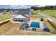 Beautiful aerial view of a home featuring a large in-ground pool, manicured lawn, and fenced backyard at 1302 Reading Ct, Burlington, NC 27217